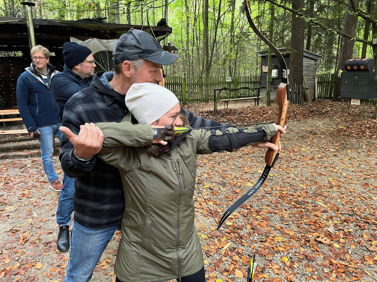 Our team learned archery as part of an off-site event.
