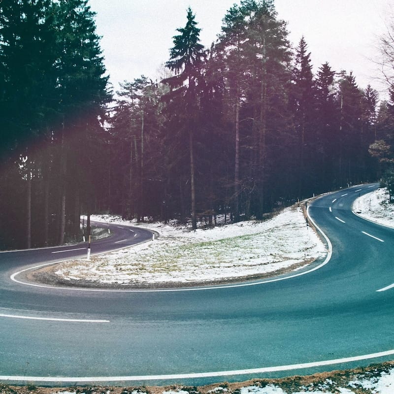 Winding road with snowy landscape